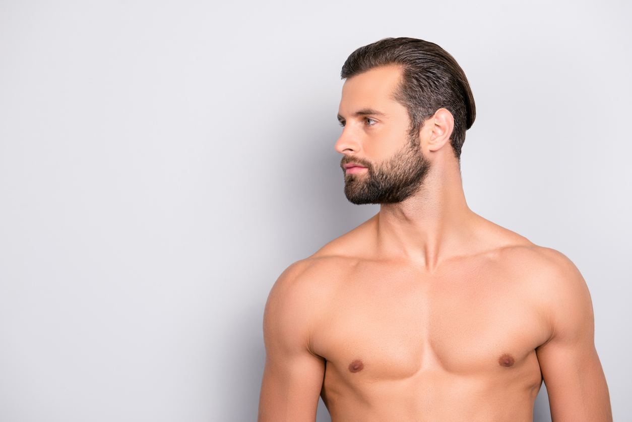 Man showing a flatter chest after gynecomastia surgery.